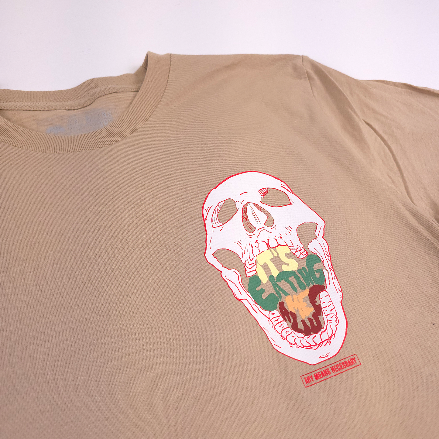 any means necessary shawn coss eating me alive t shirt mushroom tan front up close