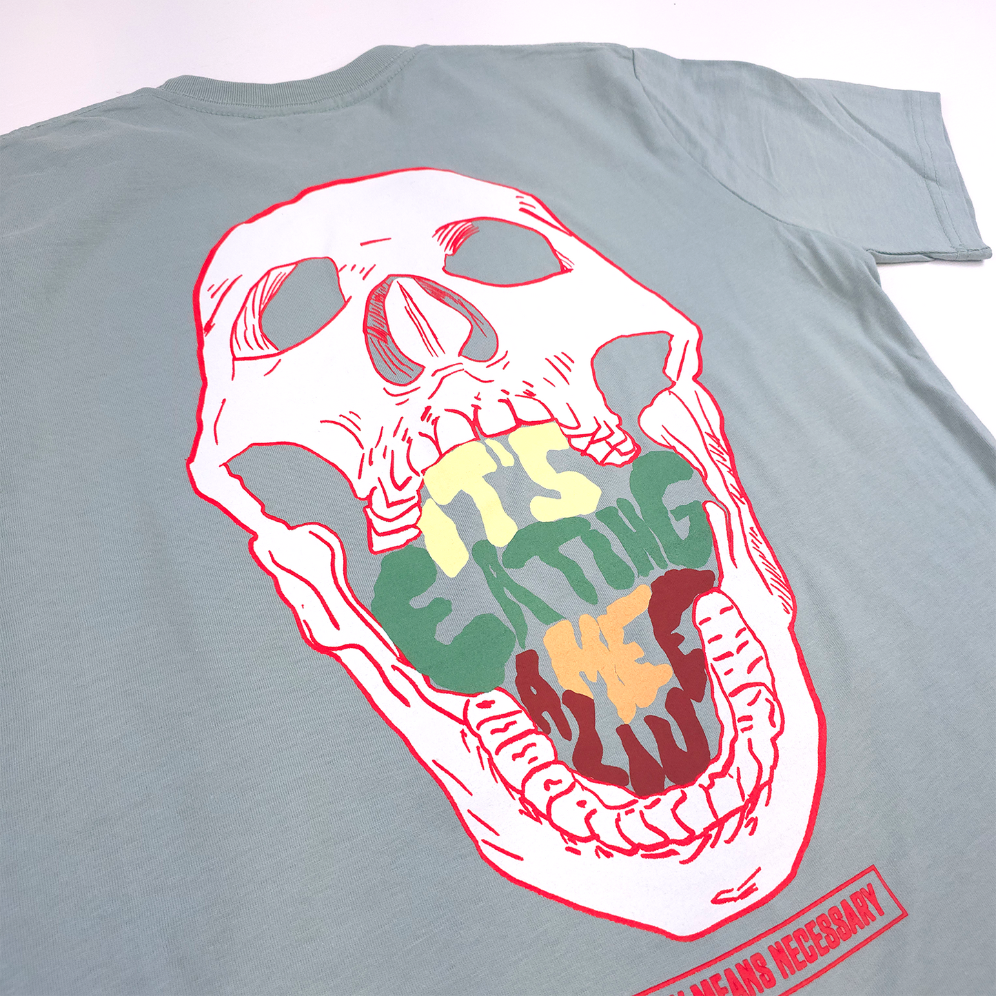 any means necessary shawn coss eating me alive t shirt seafoam back up close