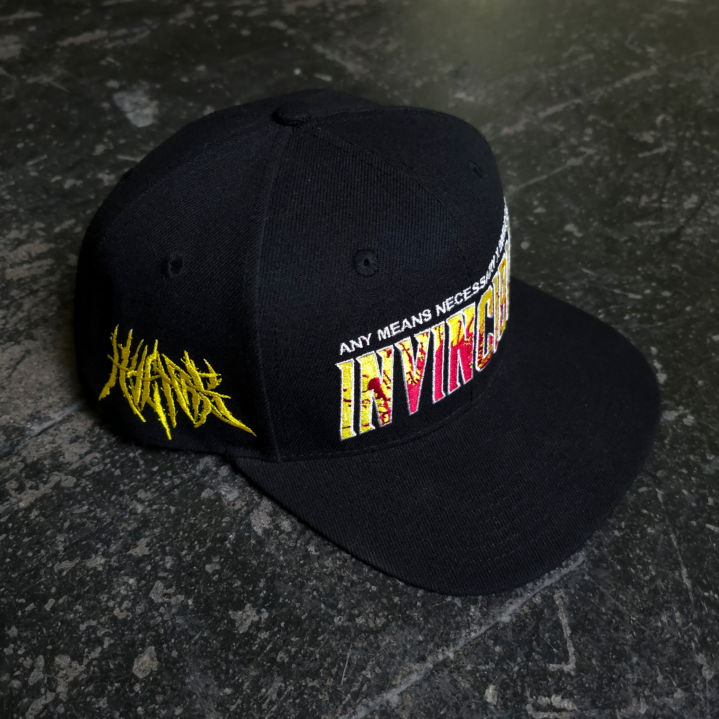 Invincible Splatter Hat – Any Means Necessary Clothing
