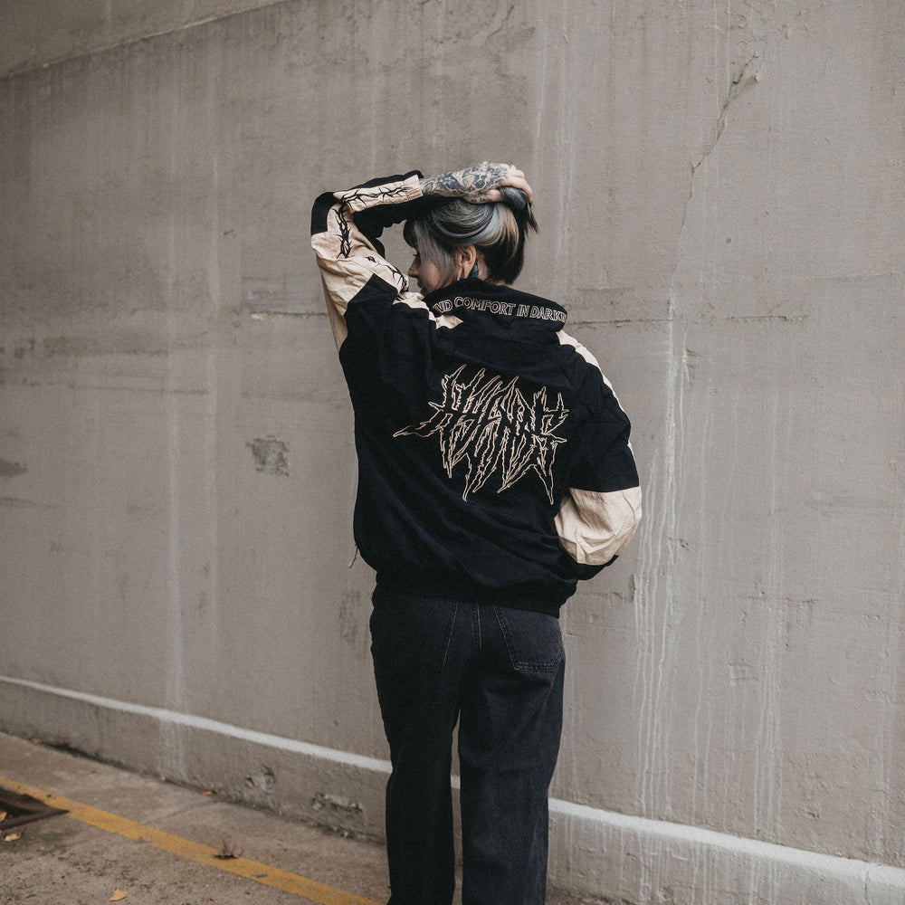 
                      
                        any means necessary shawn coss dust storm windbreaker black and tan lifestyle back
                      
                    