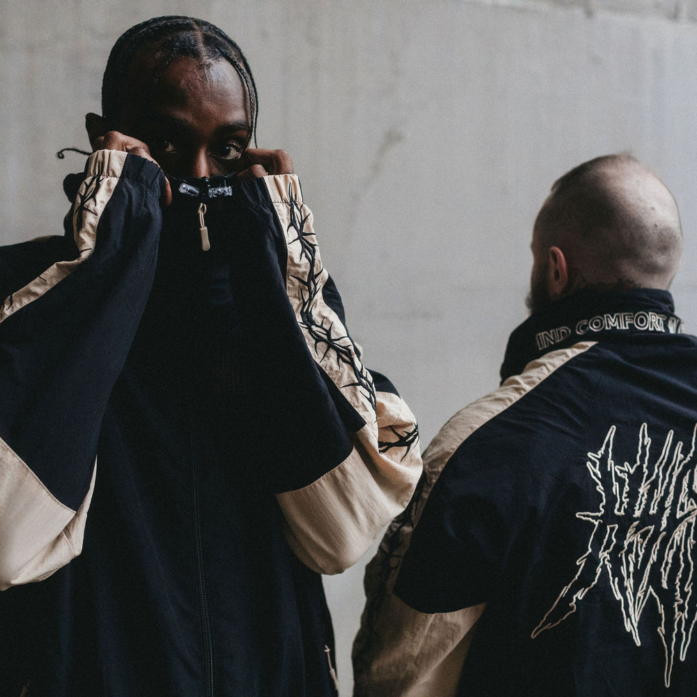 
                      
                        any means necessary shawn coss dust storm windbreaker black and tan lifestyle
                      
                    