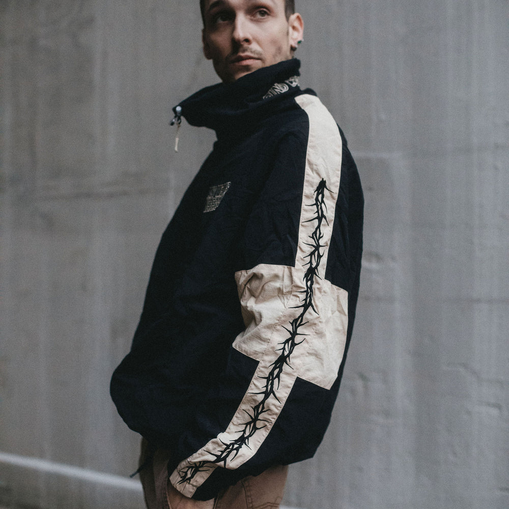 
                      
                        any means necessary shawn coss dust storm windbreaker black and tan up close sleeve
                      
                    