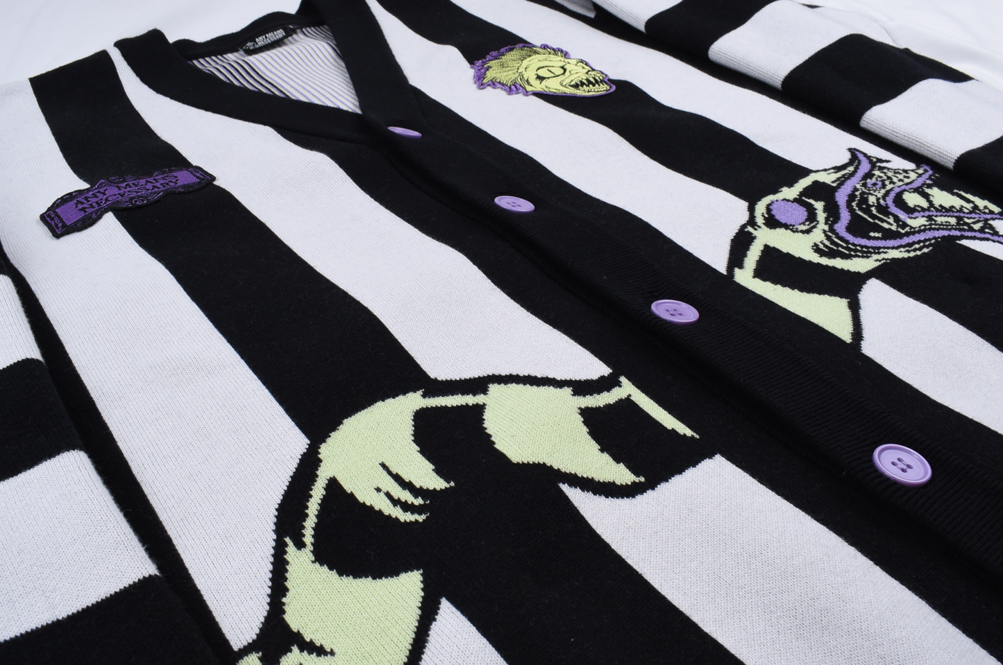 
                  
                    any means necessary shawn coss beetlejuice sand snake cardigan knit sweater up close snake
                  
                