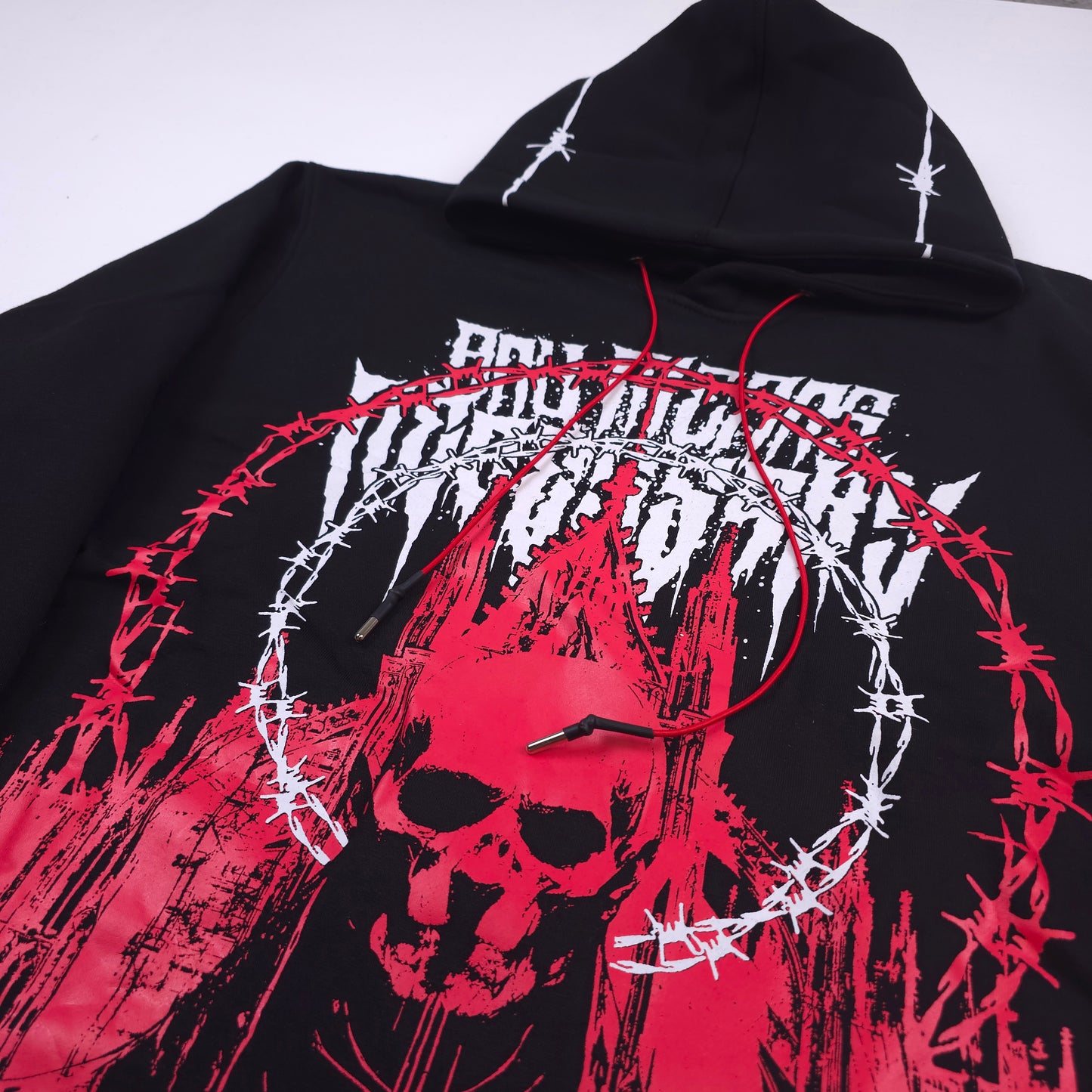 any means necessary shawn coss cathedral pullover hoodie black and red close up 