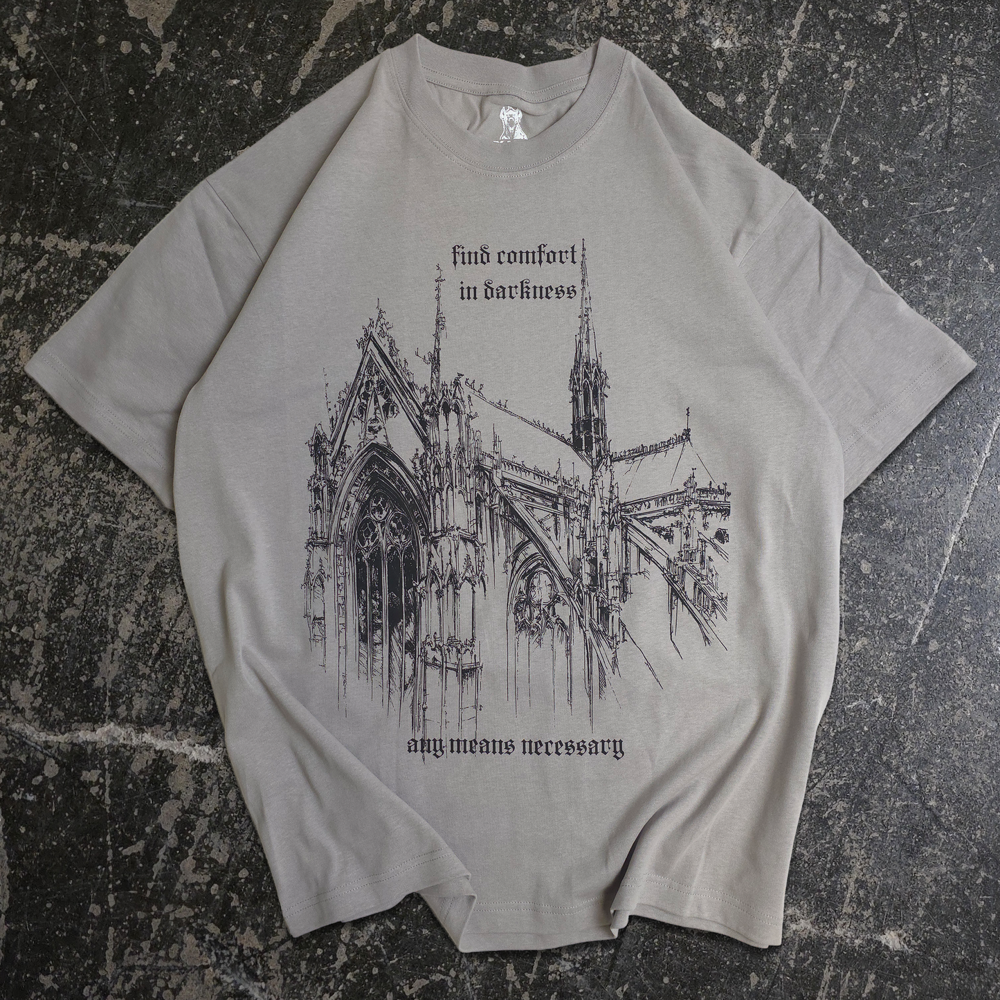 Gray t-shirt with a gothic cathedral design and text on a white background