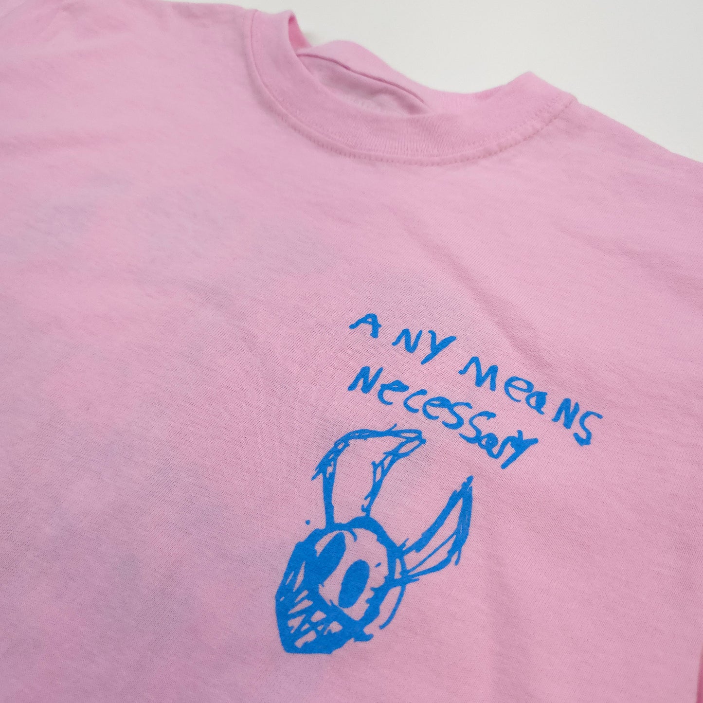 any means necessary shawn coss corrupted youth kids t shirt pink front up close