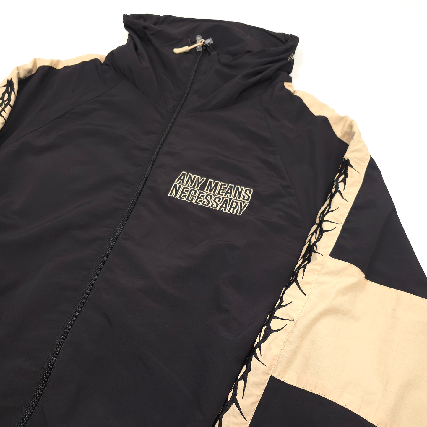 any means necessary shawn coss dust storm windbreaker black and tan front