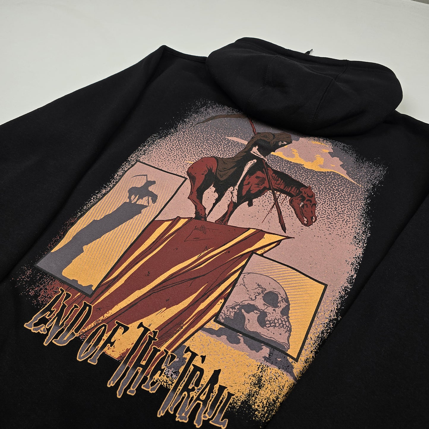 
                  
                    any means necessary shawn coss end of the trail pullover hoodie black back close up
                  
                