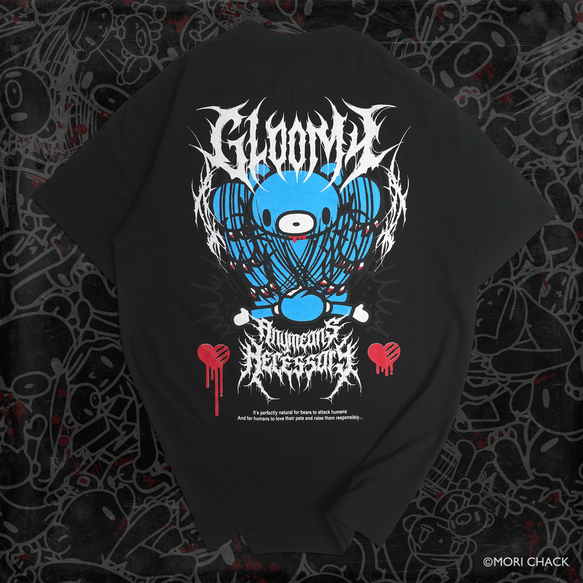 A black short-sleeve graphic T-shirt laid flat on a dark patterned background. The shirt features a large front print with a blue circular eye-like design, white jagged text reading 'GLOOMY' and 'Gloominess Is Eternal,' and small red heart graphics with dripping red text.