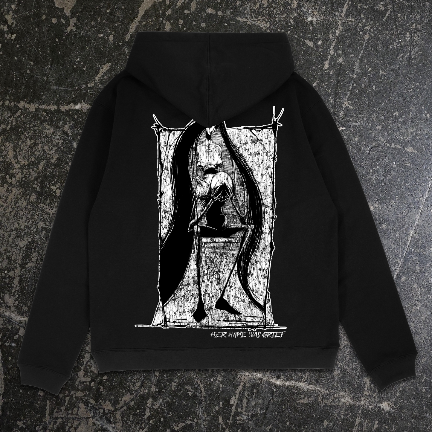 Black hoodie with a white graphic design on the back against a textured gray background, shawn coss art about grief