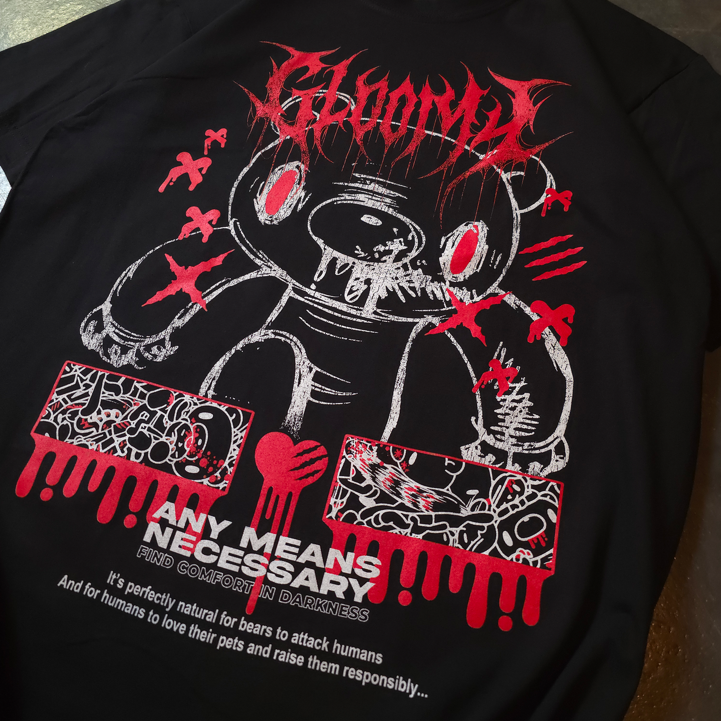 Black t-shirt with graphic design and text on a dark surface