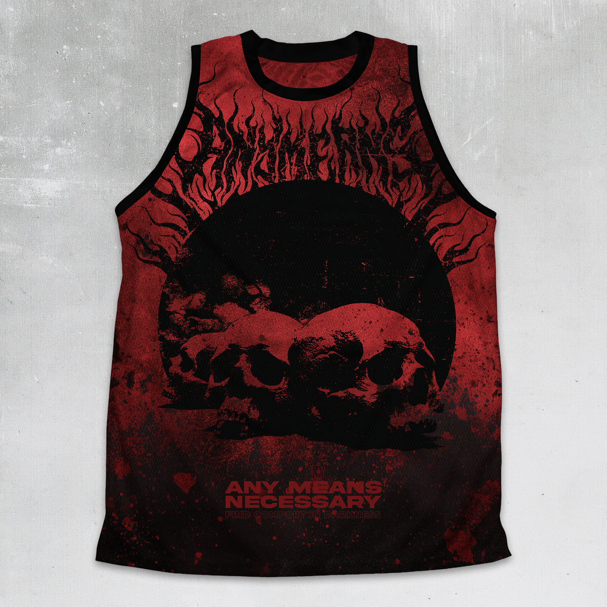 A sleeveless tank top with a black and red graphic print featuring skulls, flames, and the text 'ANY MEANS NECESSARY', displayed against a textured gray background.