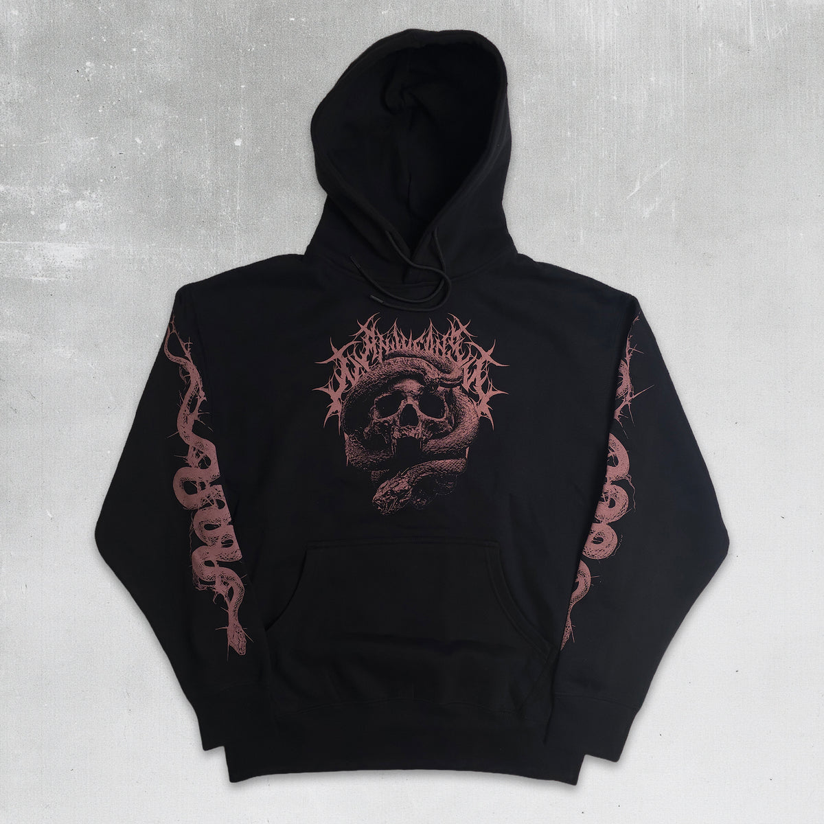 A black pullover hoodie featuring a dark pink graphic print on the front with a skull and snake design, and matching snake graphics printed down both sleeves, laid flat against a textured gray background.