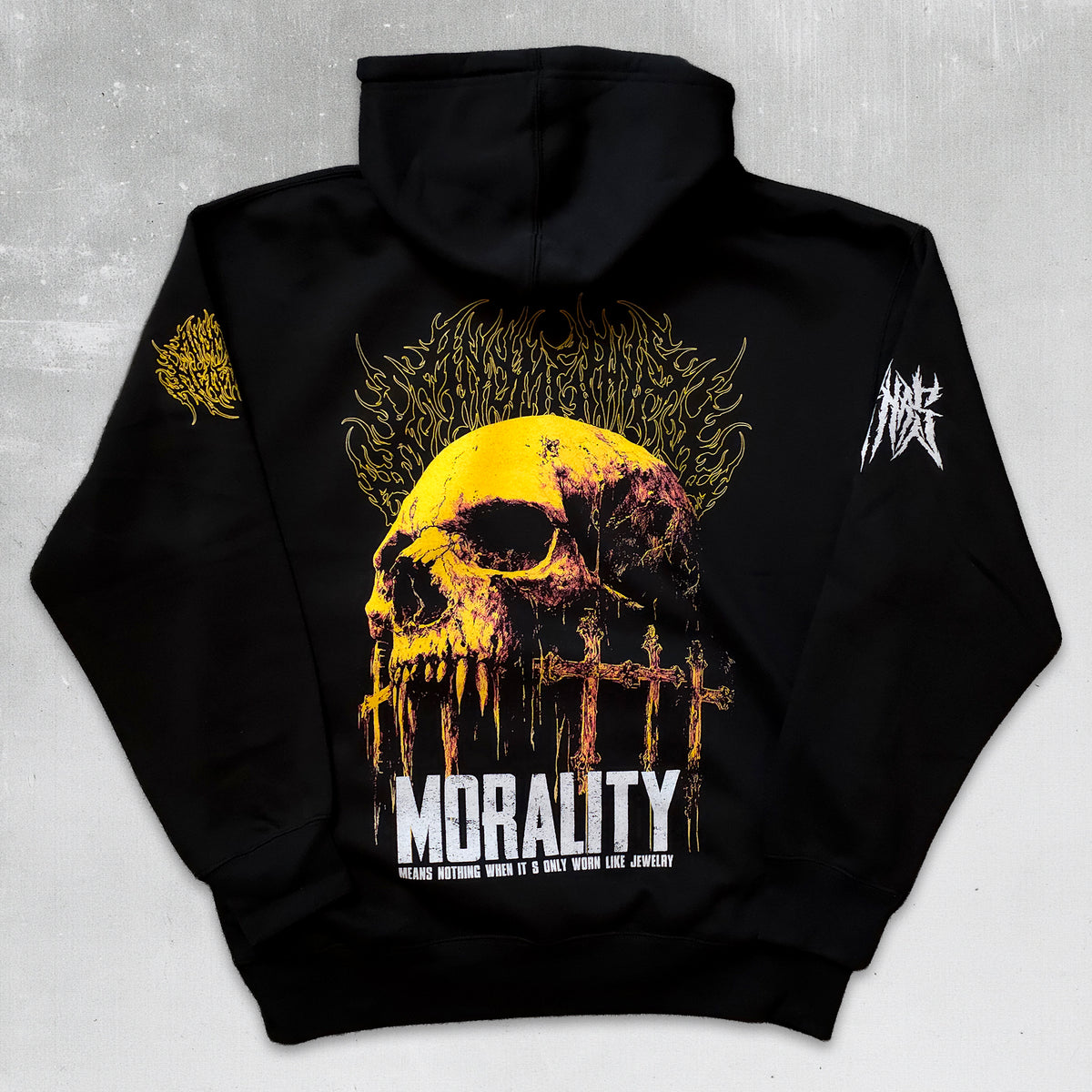 Black pullover hoodie shown from the back, featuring a large yellow and black skull graphic with the word "MORALITY" in white across the lower back, plus smaller yellow and white graphics on both sleeves, photographed against a light gray textured background.