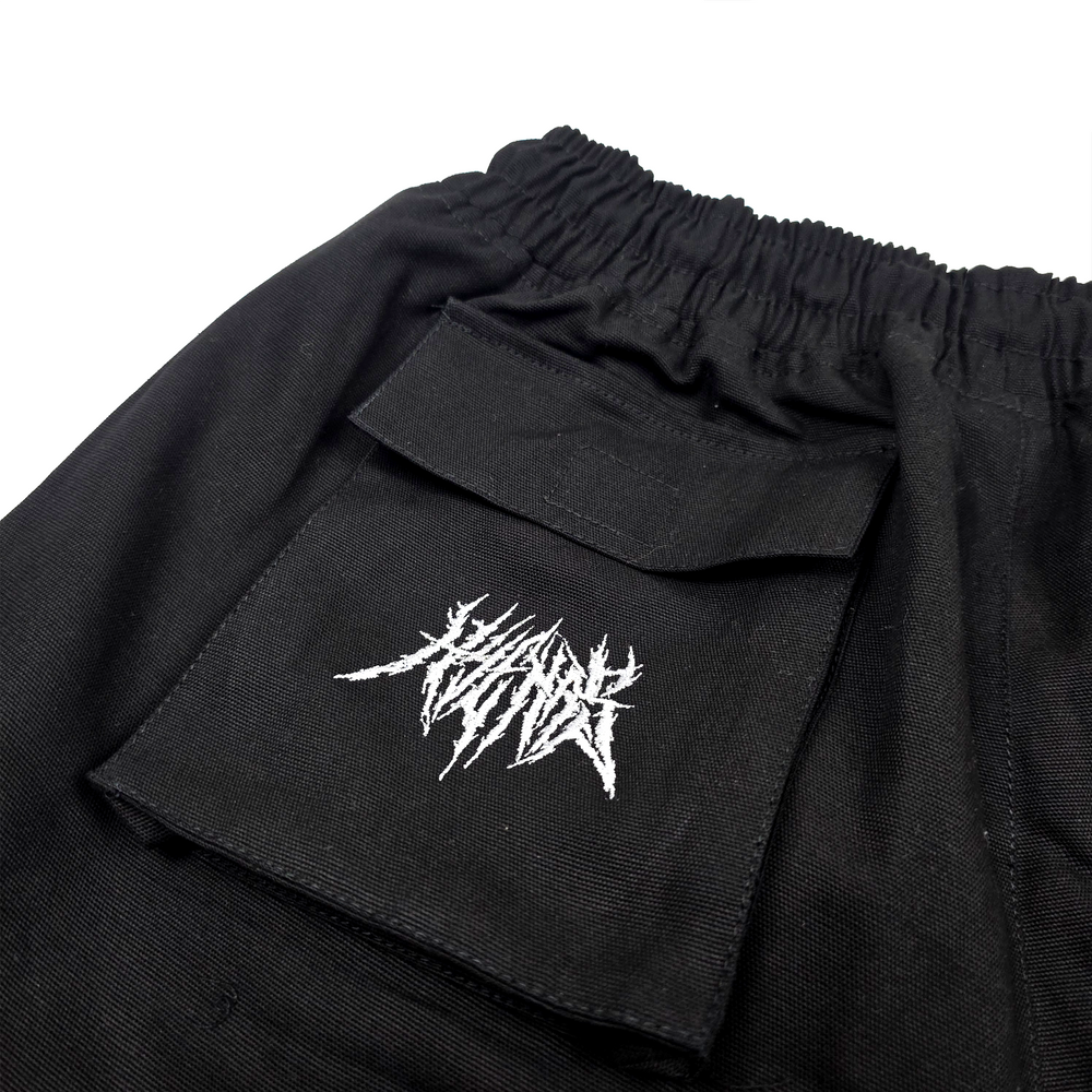 
                      
                        any means necessary shawn coss pack tactics cargo shorts black back up close
                      
                    