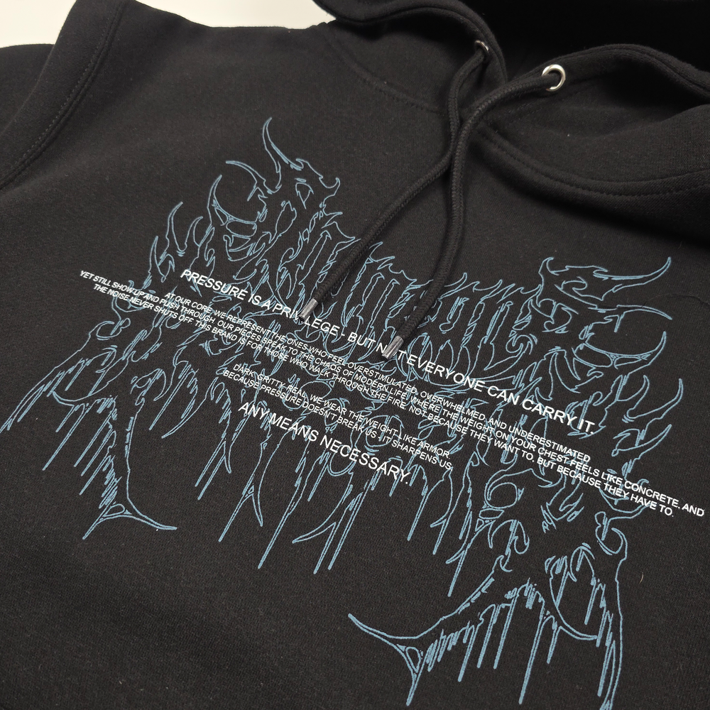 
                      
                        any means necessary shawn coss pressure is a privilege pullover hoodie black up close front
                      
                    