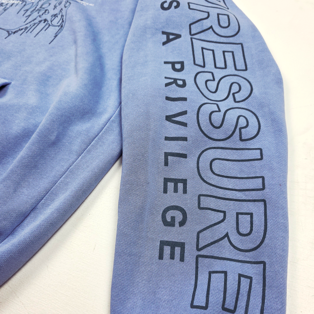 
                      
                        any means necessary shawn coss pressure is a privilege pullover hoodie grape sleeve up close
                      
                    