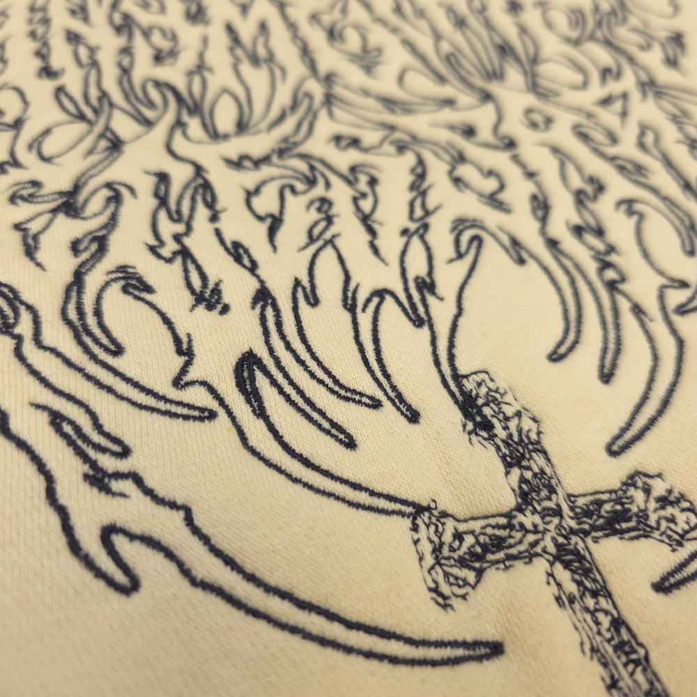 
                      
                        any means necessary shawn coss sigil pullover hoodie cream up close front
                      
                    