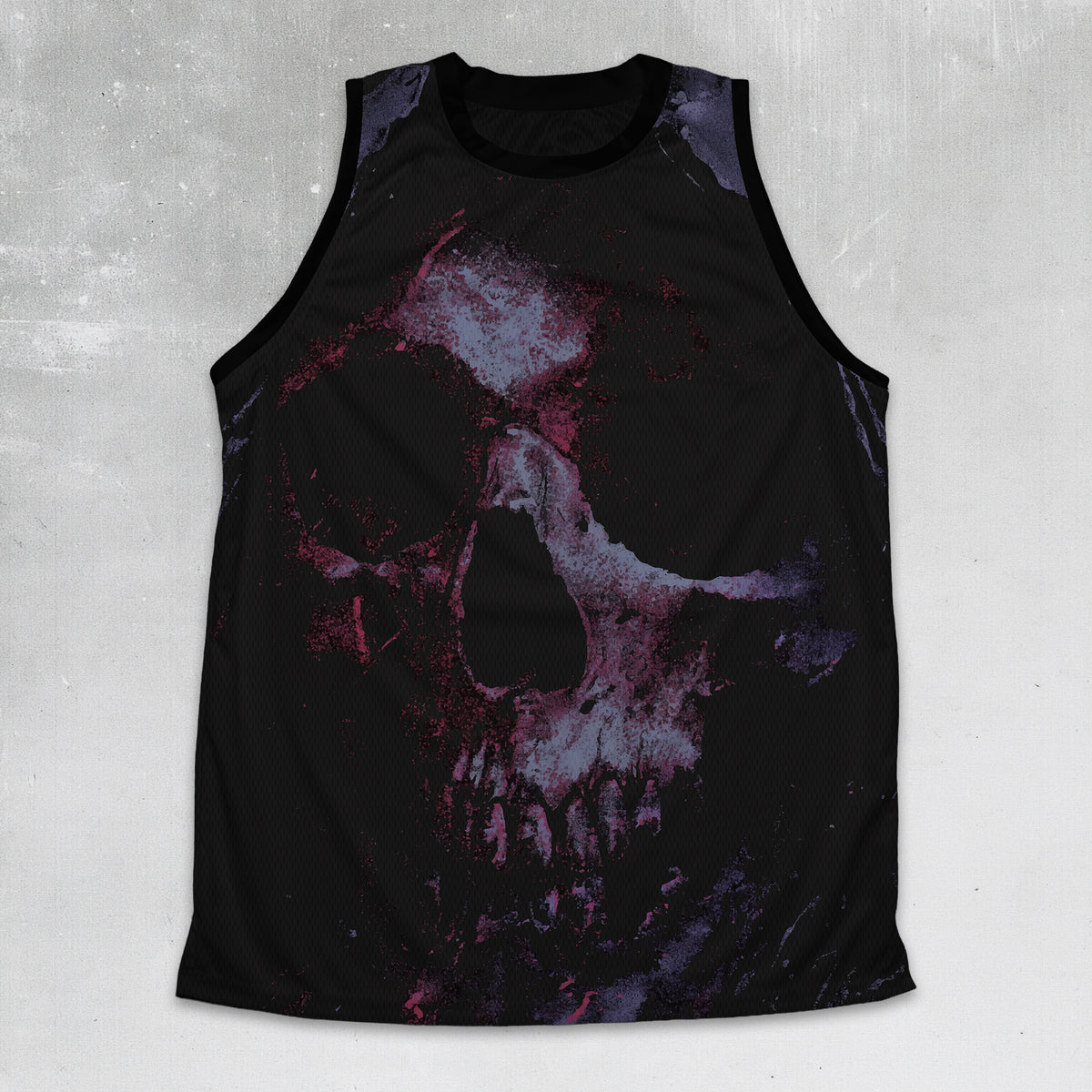 A sleeveless black tank top featuring a large distressed skull graphic in purple, pink, and white tones, displayed against a textured gray background.