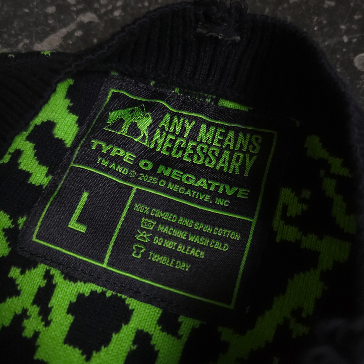 any means necessary shawn coss suspended in dusk type of negative knit sweater inside tag