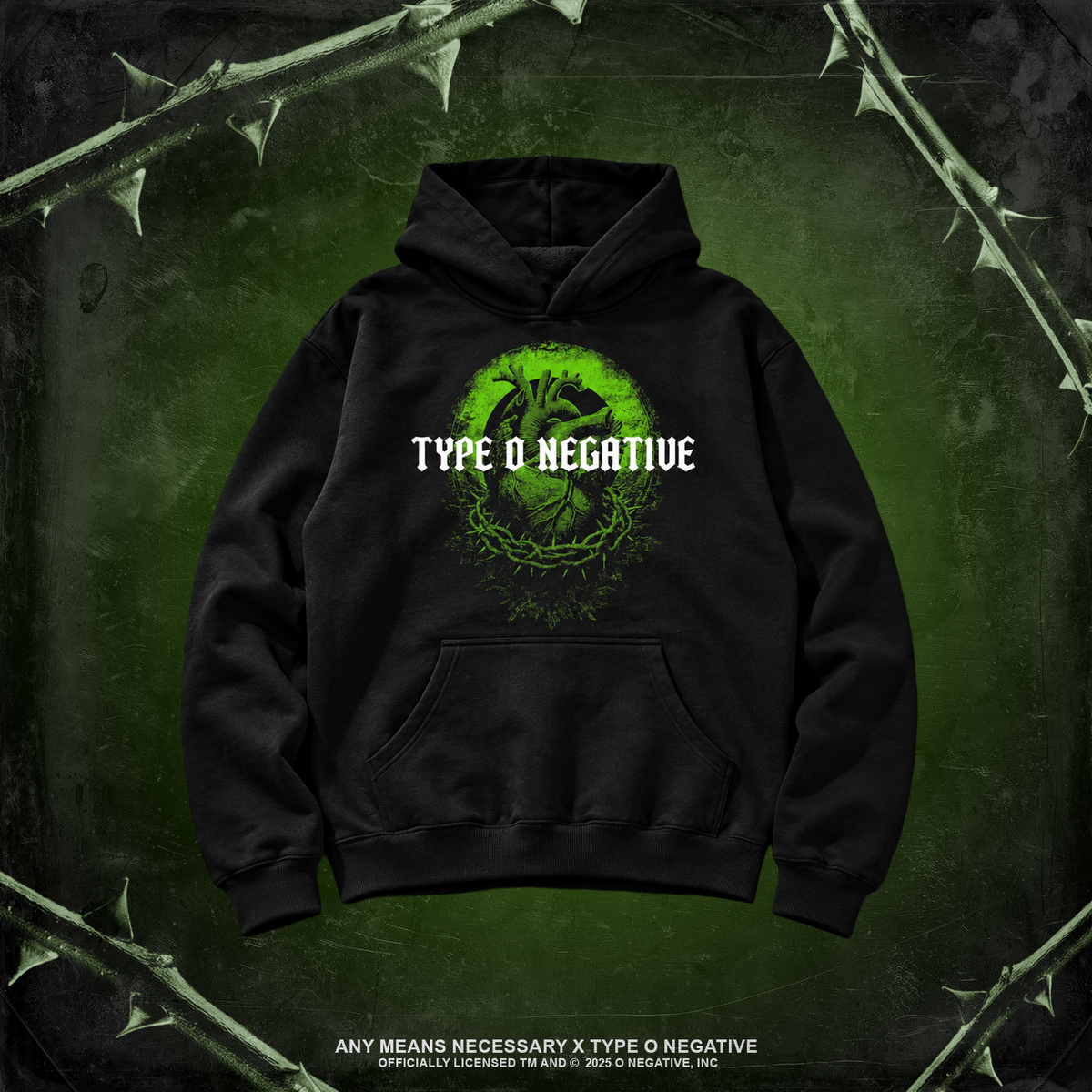 A black pullover hoodie with a green circular graphic and the text 'TYPE O NEGATIVE' printed on the chest, displayed against a dark green textured background with thorny branches.