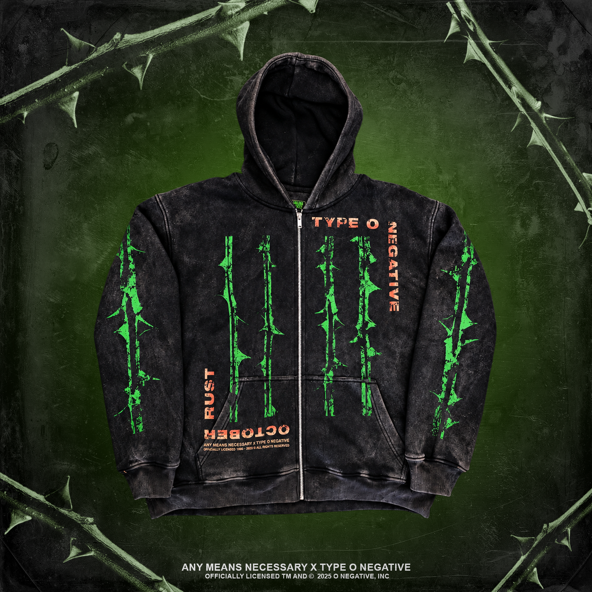 A black acid-wash zip-up hoodie with green barbed wire graphics and orange text, displayed against a dark green background with thorny branches. October Rust Zip Up Type O Negative officially licensed Any means Necessary