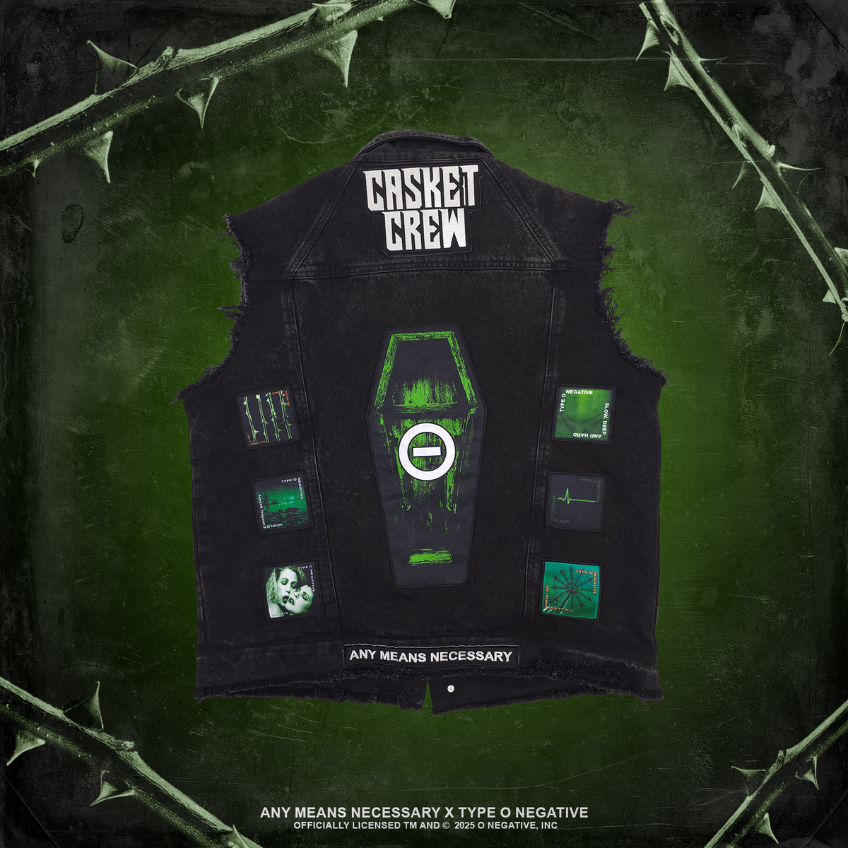 Black denim vest with green and white gothic graphics, including 'CASKET CREW' text and coffin patch, displayed on a dark green textured background with thorny branches. Type O Negative Any Means Necessary