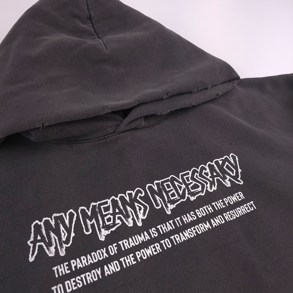 
                      
                        any means necessary shawn coss trauma pullover hoodie pigment black front up close
                      
                    