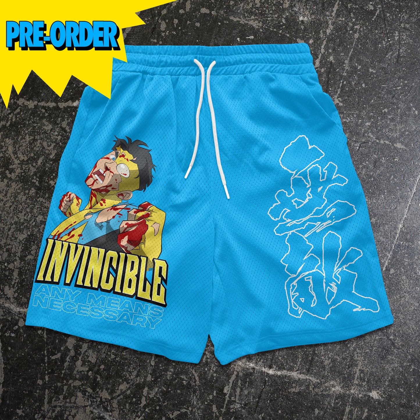 Blue shorts with graphic design and 'Invincible' text on a textured black background